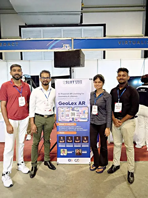 Four team members standing beside the GeoLex AR research display at Techno 2026